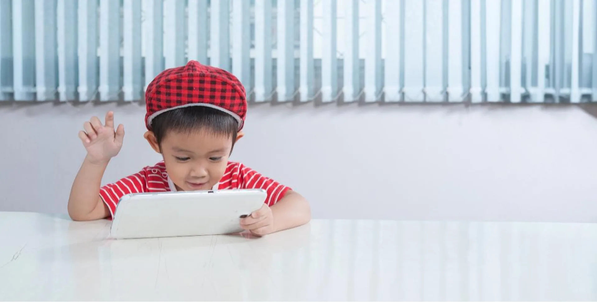 asian-boy-using-tablet-home